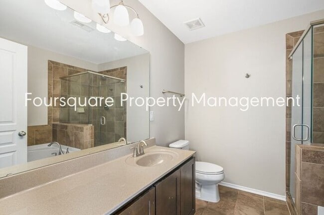 Building Photo - Charming Townhome with Open Layout, Back Patio & One-Car Garage – Near RTP, RDU & Everyday Conven...