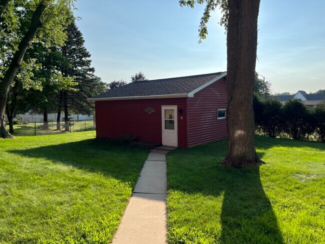 Large 530 sq ft utility shed located in back yard with single stall garage door - 2790 S Ridge Rd