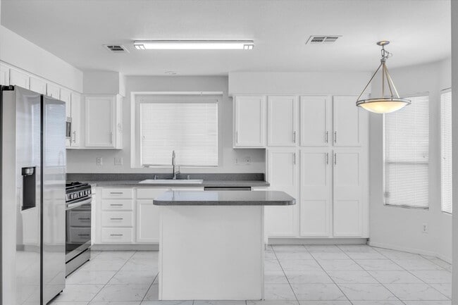 Building Photo - SE!!  Windmill and 215!! Newly remodeled!! All Tile Floors down stairs!! Low Maintenance Desert L...