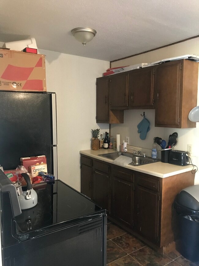 Full Kitchen with Range/Oven & Refrigerator - Campus Apartments East