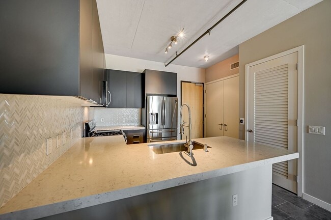 Building Photo - Fully Furnished 4th-Floor Condo with Stunning Downtown Views!