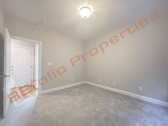 Building Photo - Freshly Painted with New Carpet and Wood F...