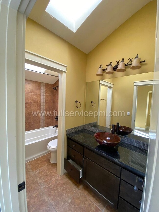 Building Photo - Spacious townhome with private backyard, garage parking, multiple decks, and a dedicated home off...