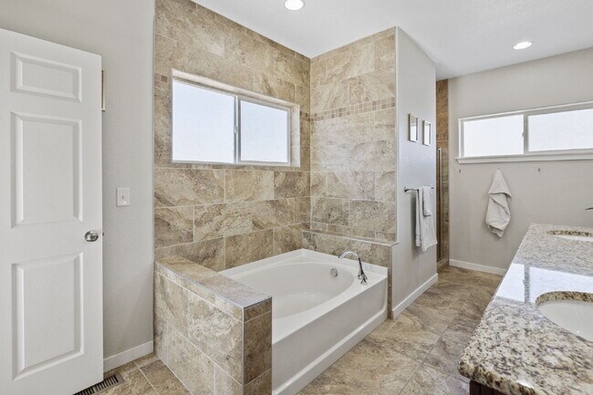 Building Photo - Spacious Home with Finished Basement, Granite Kitchen & Fenced Yard Near Fort Carson