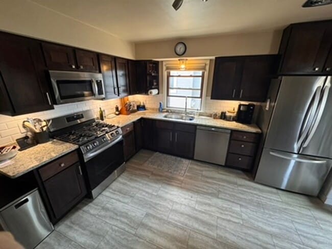 Building Photo - AVAILABLE SEPTEMBER 1: Updated 4-bedroom single family home on a quiet block- with 2 kitchens, 2 ...