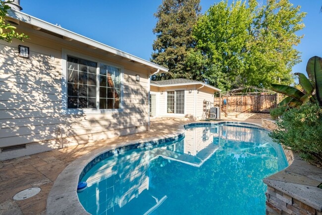 Building Photo - POOL PARADISE IN A COVETED NEIGHBORHOOD STYLISH UPGRADES | EXTREME CONVENIENCE