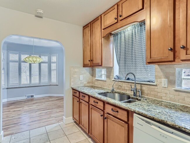 Building Photo - Evolve Real Estate: Available 8/8/26 Brick Tudor with Large Yard and Finished Basement!