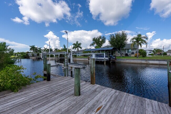 Building Photo - 3 BEDROOM • 2 BATHROOM • PRIVATE POOL • WATERFRONT • BOAT LIFT • ZERO DEPOSIT MOVE-IN AVAILABLE