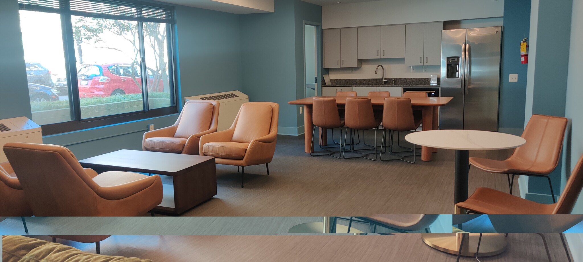 Community Room seating area, with kitchen and bathroom - 5410 Connecticut Ave NW