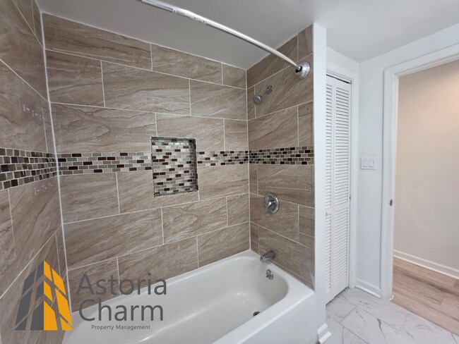 Building Photo - 3 Bedroom End Unit with Finished Basement and Fenced Yard on E 28th Street