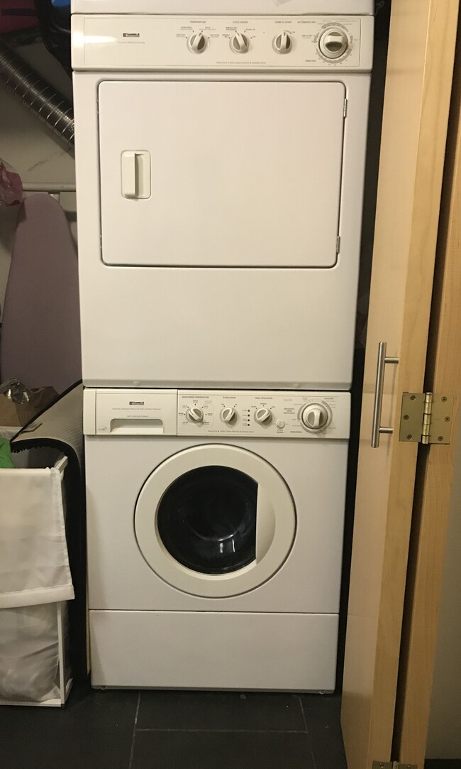 Washer & Dryer in closet off bathroom. - 1400 NW Irving St