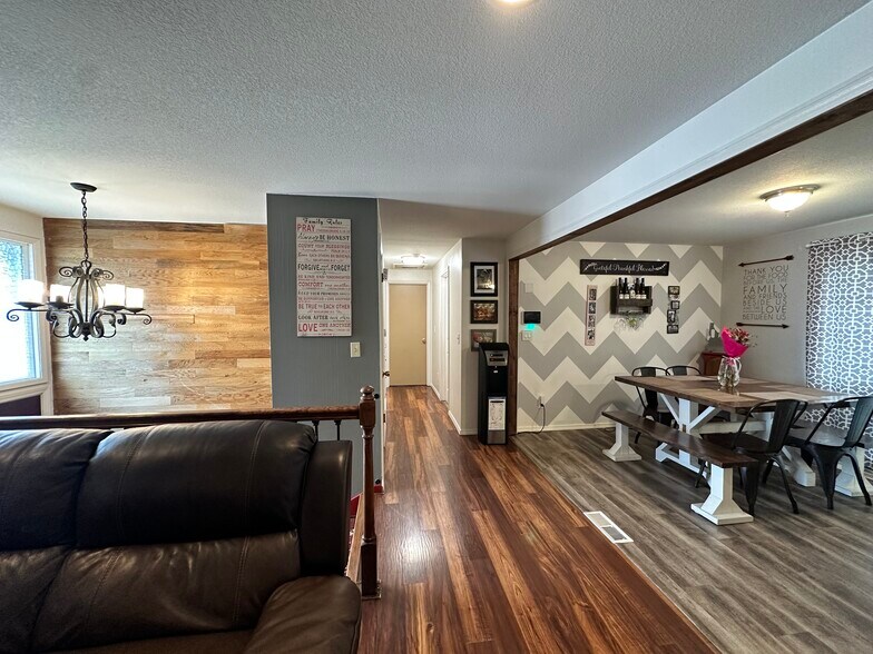 Living room and kitchen with hallway leading to rooms (2) and main bathroom - 219 Thayer Dr