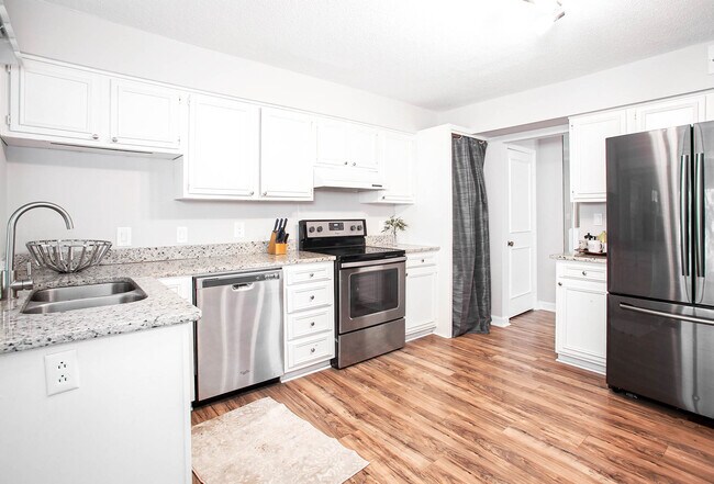 Bright kitchen featuring stainless steel appliances & granite countertops! - 7022 Quail Hill Rd