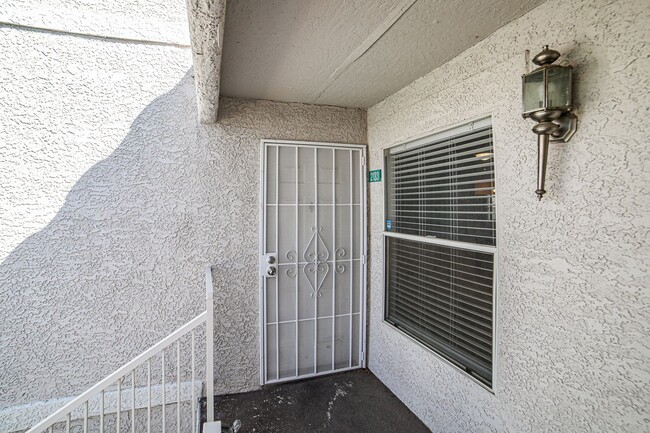 Building Photo - Cozy second floor condo located in gated c...