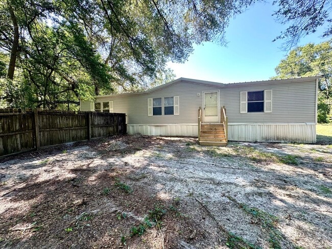 Building Photo - Privacy and Space in this 3/2 Home at the ...