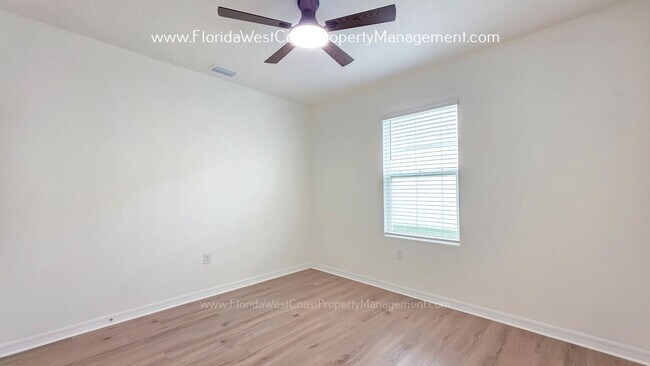 Building Photo - MOVE IN READY ! 4 BEDROOM/2 BATH! TILE- LVP THROUGHOUT! LAWN MOWING INCLUDED!