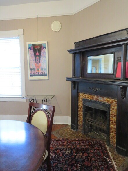 Occupied Back Parlor/Dining Fireplace. *Using picture molding to hang art. - 1217 Java Pl