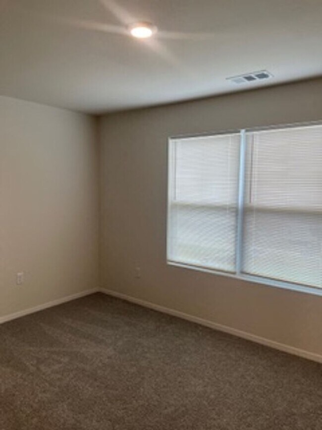 Building Photo - Three Bedroom / Two Bath Home/Two Car Garage/Fenced Backyard