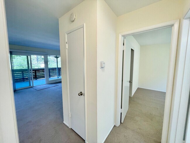 Building Photo - Sunlit 2BD/1BA w/ Private Balcony + Backyard! New Carpet! Assigned Parking! PROGRESSIVE