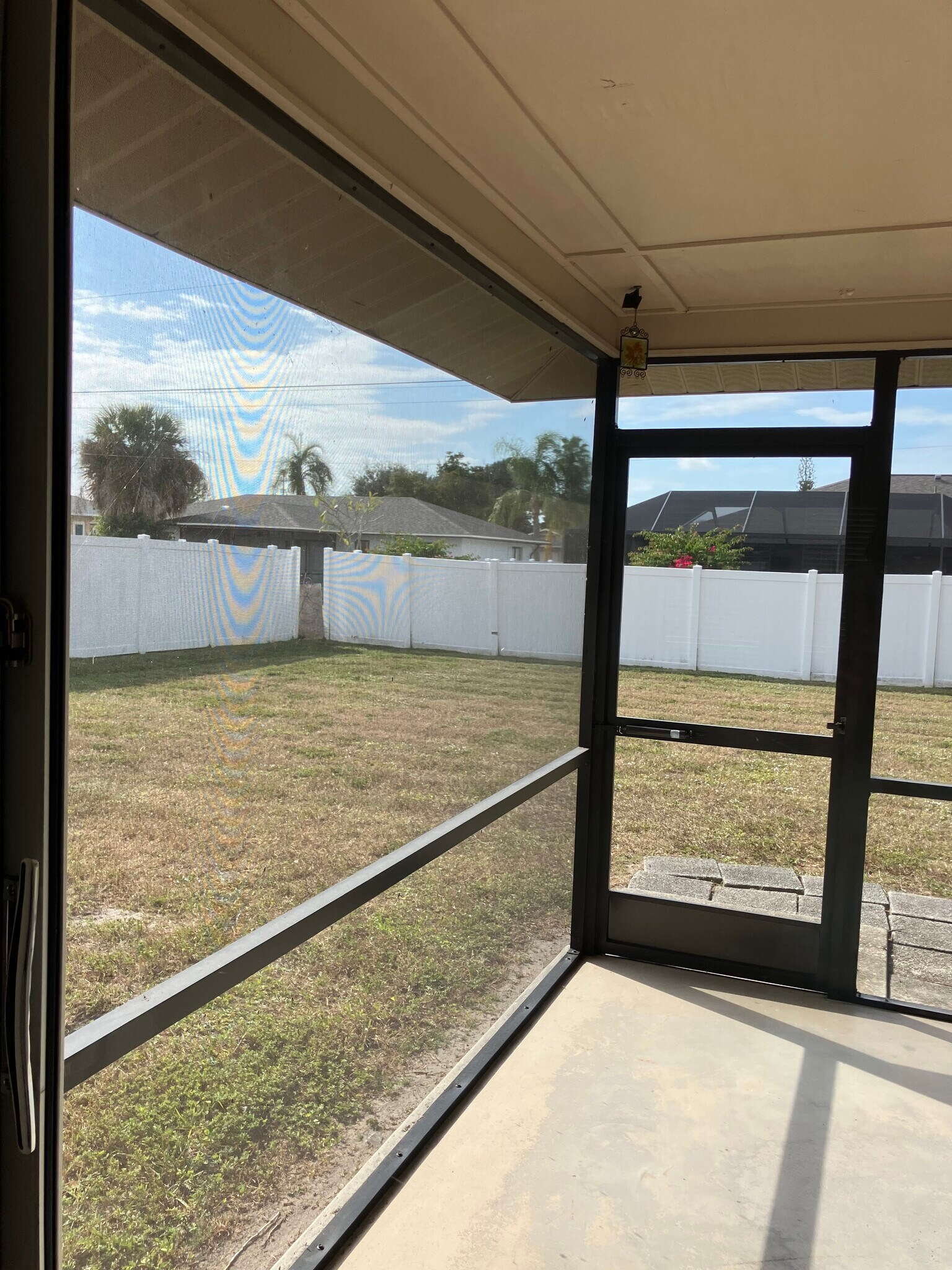 Patio view with neighbors providing privacy fencing - 3712 SW 5th Pl