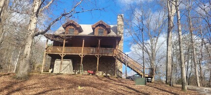 Building Photo - 2 bedroom 1 bath fully furnished log cabin...