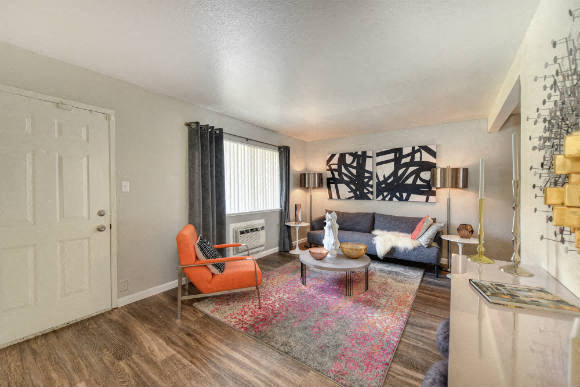 Living Room with Hardwood Inspired Floors - Olympus Park Apartments