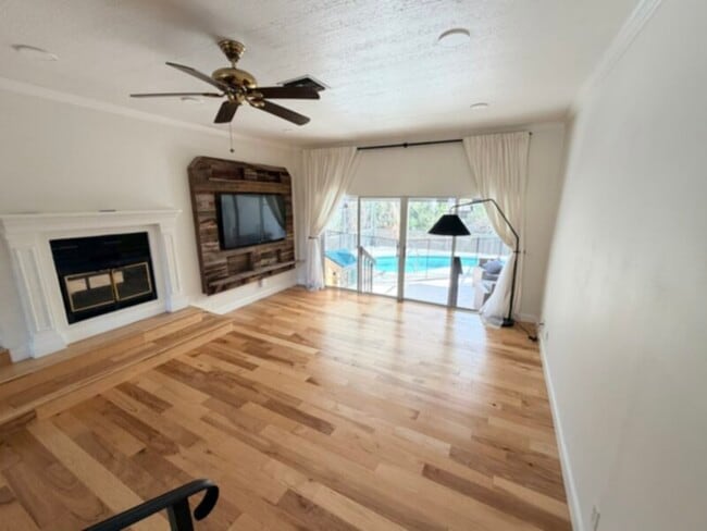 Building Photo - 3 Bedroom 2 Bath with lawn and pool included