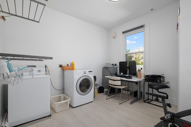2nd floor bedroom #4, currently used as an office and laundry room. - 31 Dartford Ave