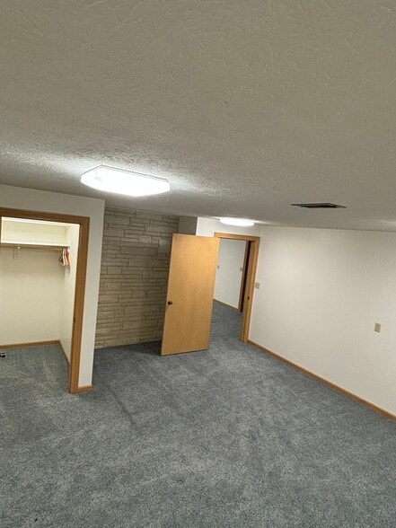 Fully finished basement bedroom with closet - 815 E 6th St