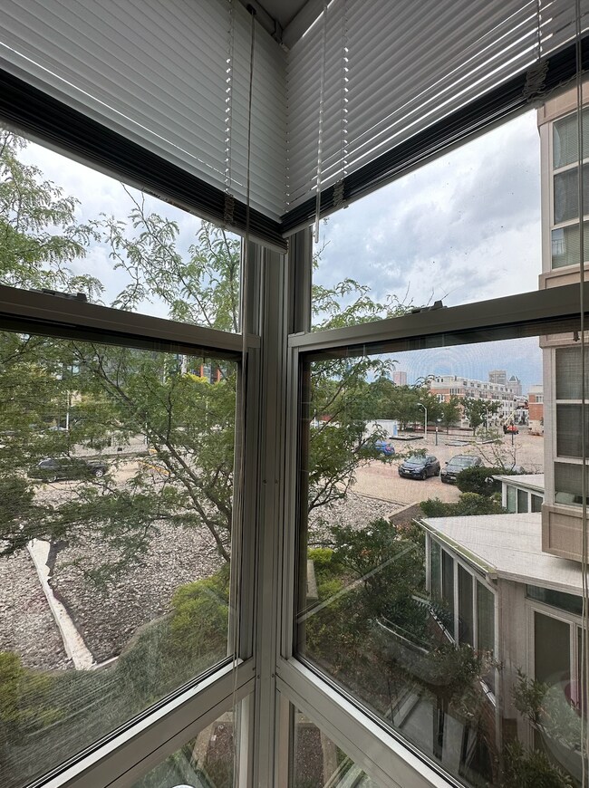 sunroom view of parking lot in front of building - 23 Pierside Dr