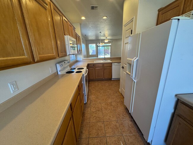 Building Photo - Coral Canyon Gem with NEW CARPET & TWO CAR...