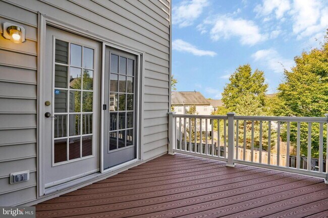Building Photo - This beautifully maintained brick-front, three-level townhome is located in a highly sought-after...