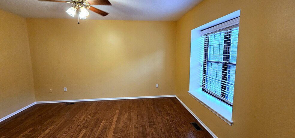 Natural Light All Day | Large window with blinds and warm hardwood underfoot - 43 Tynemouth Ct