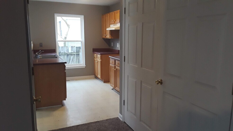 Living Room to kitchen (utility closet) - 1216 Lipps Ln