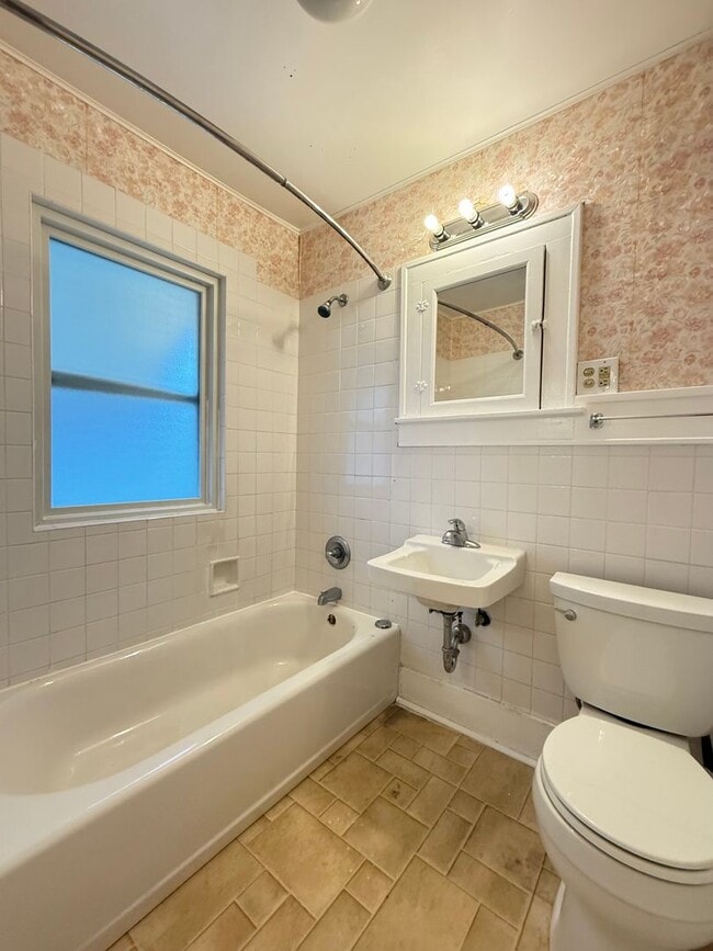 Building Photo - Bright West End Home with Enclosed Porch, Fenced Yard & Garage