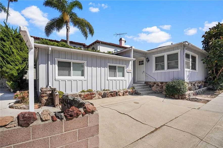 View of the home with the largest bedroom in the foreground and living room on the right side - 1500 Voorhees Ave