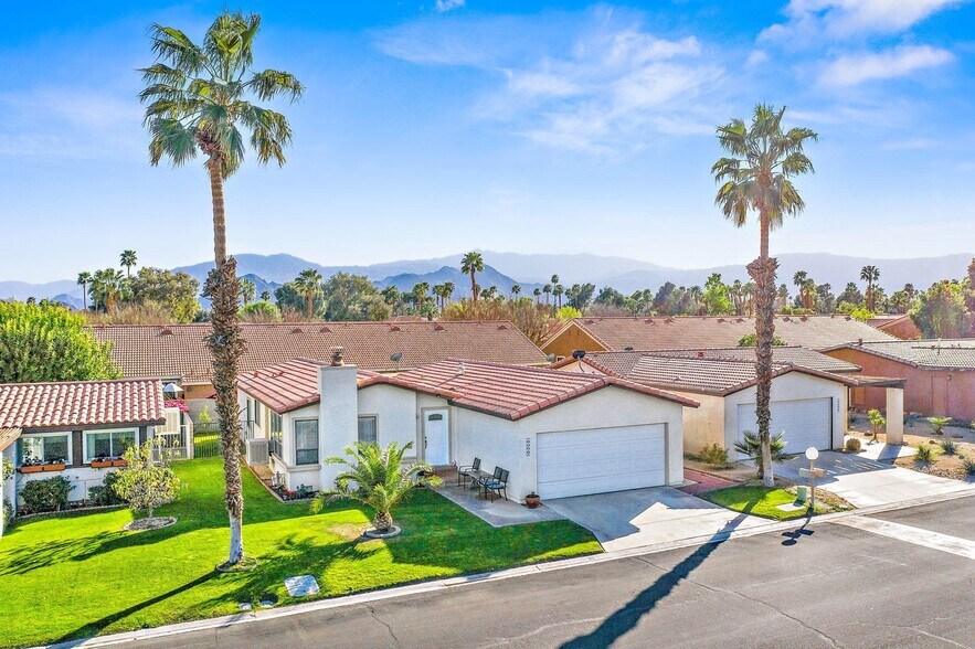 Front of home drone pic. - 77949 Calypso Rd