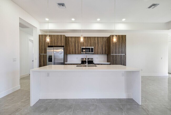 Building Photo - Brand-New Coastal Retreat | 4BR Home in NW Cape Coral