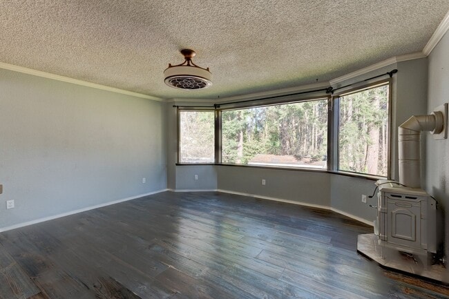 Building Photo - Spacious 4-Bedroom Home with Fireplace, Fenced Yard, and 2-Car Garage