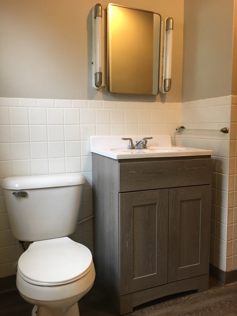 The bathroom includes fresh paint and a new vanity. - 829 3rd Ave W