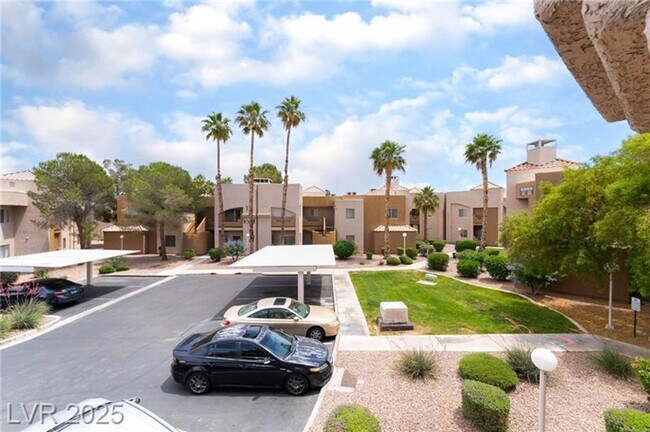 Building Photo - INVITING 2 BEDROOM TOP FLOOR CONDO IN A CE...