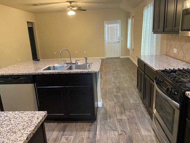 Building Photo - Three Bedroom, Two Bath, Two Car Garage, Washer and Dryer are included.