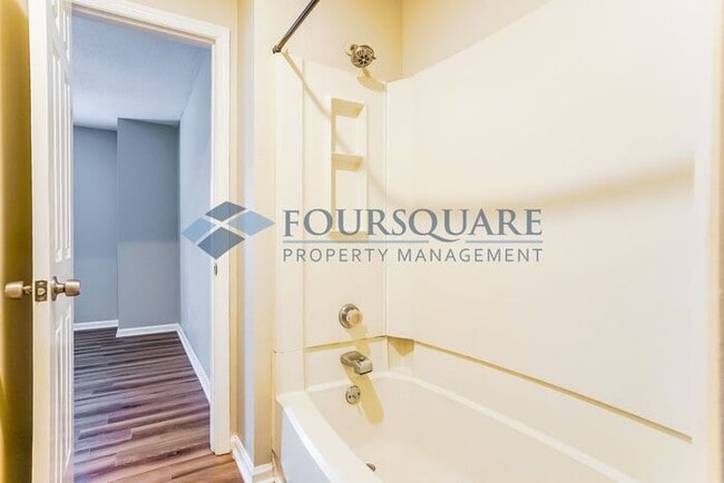 Building Photo - Inviting 2-Bed Townhome with Front Porch, Private Parking  & Storage