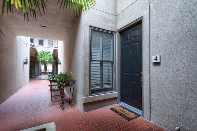 Building Photo - Gorgeous Mediterranean-style condo located...
