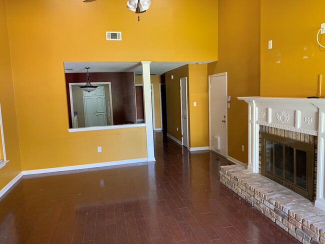 Living room with open view into dining area and kitchen - 469 Highland Creek Pkwy