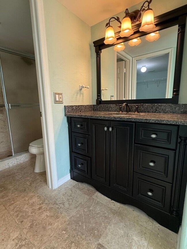 Building Photo - Stunning Sandpiper Bay 2 bed/2 bath end unit condo