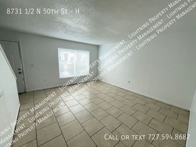 Building Photo - 8731 1/2 N 50th St-H