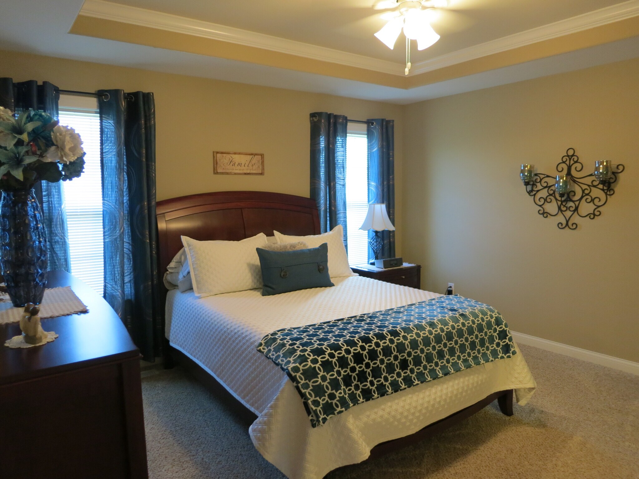 Welcoming master bedroom with tray ceiling - 1906 English Oak