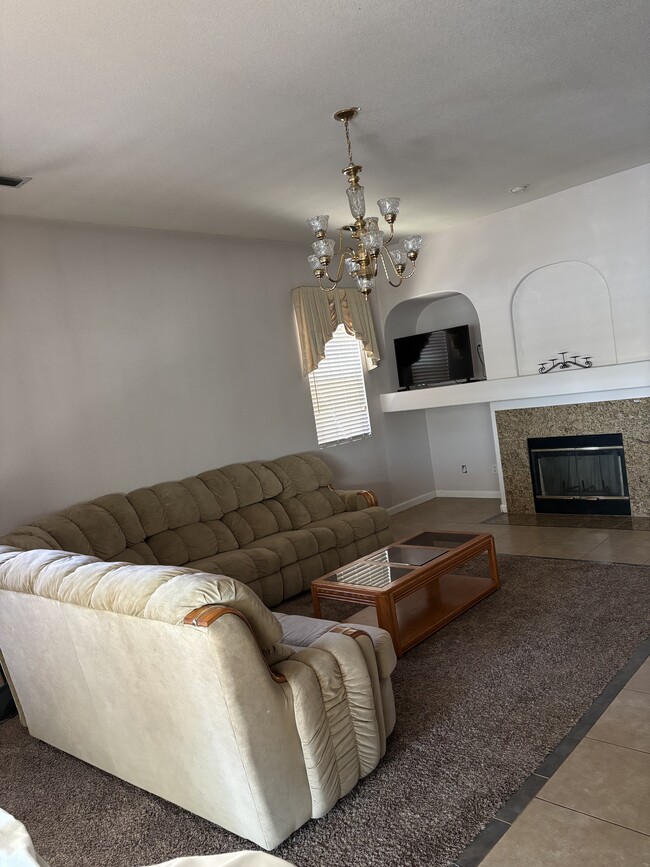 Family room w/furniture & TV - 8113 Laguna Brook Way