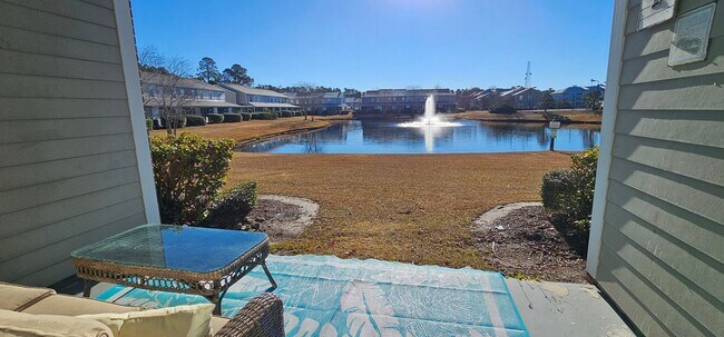 Building Photo - Stunning First-Floor, Fully Furnished Condo with Pond Views